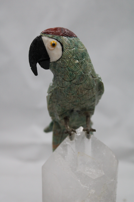 Hand carved parrot (Green Jasper) on a huge quartz crystal.